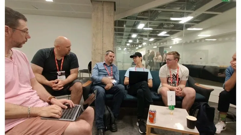 A small group sitting on couches around a low table during an unconference session at DevRelCon London